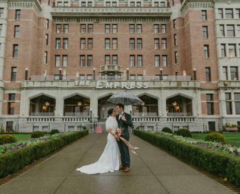 Bride and groom in front of the Fairmont Empress