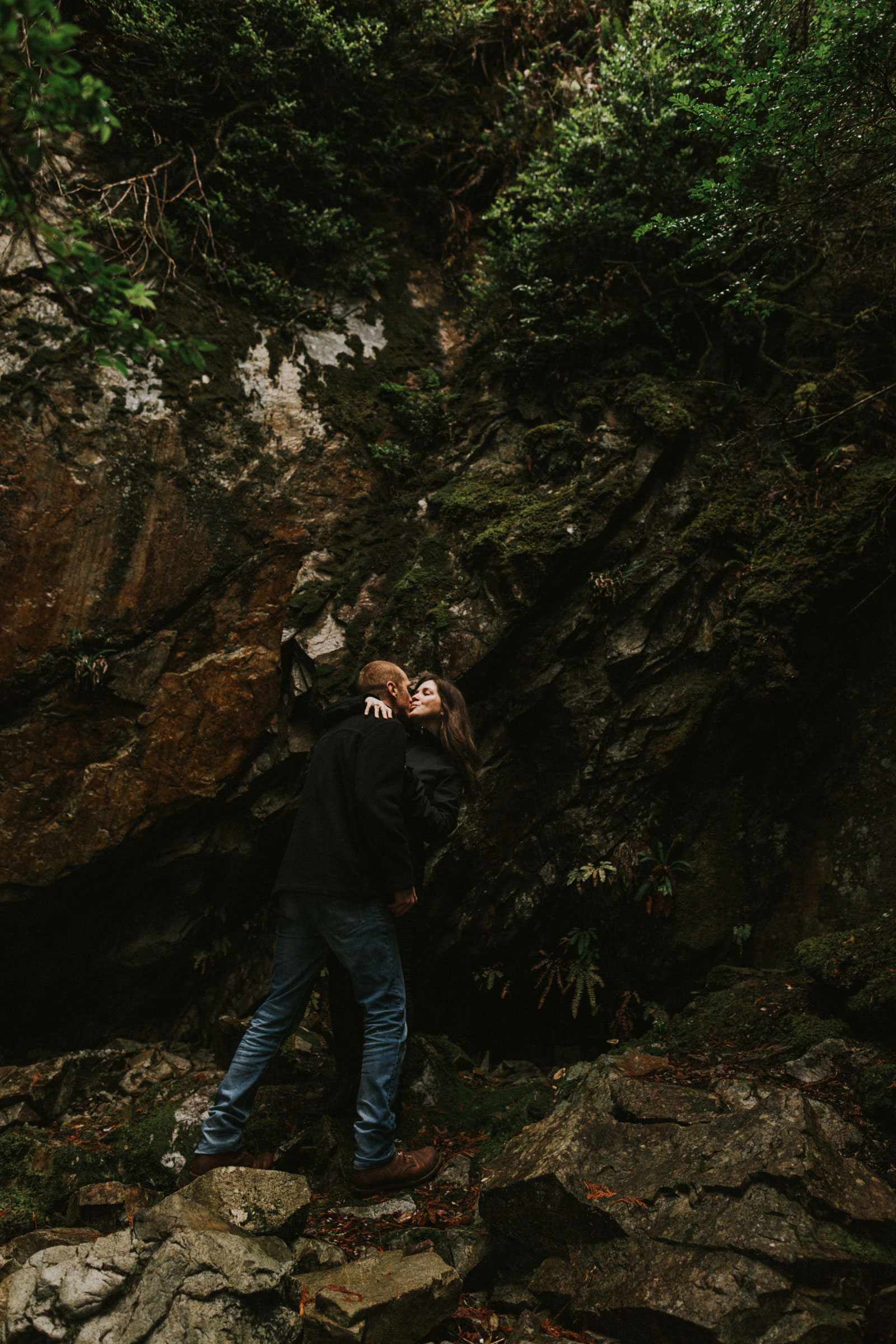 Engaged couple kidding in a grotto in Tofino BC