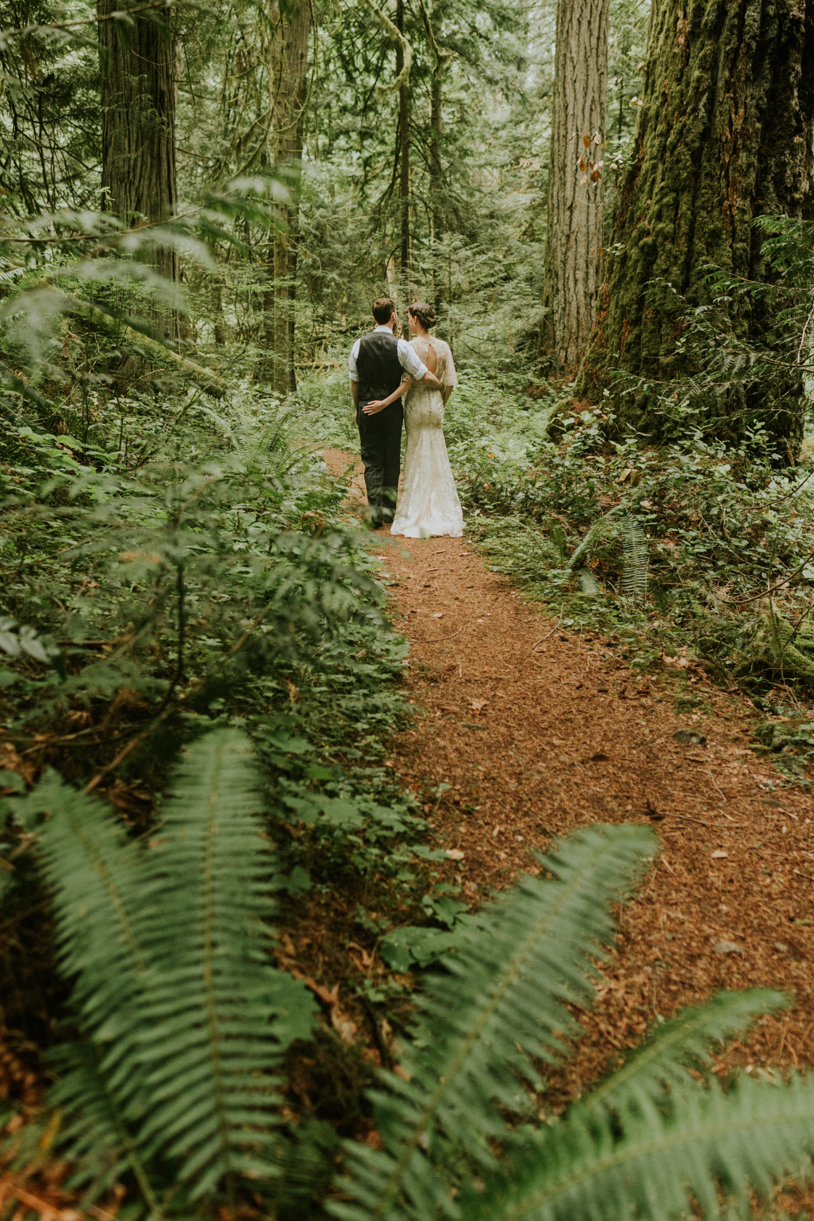 Bride and groom portraits in the forest