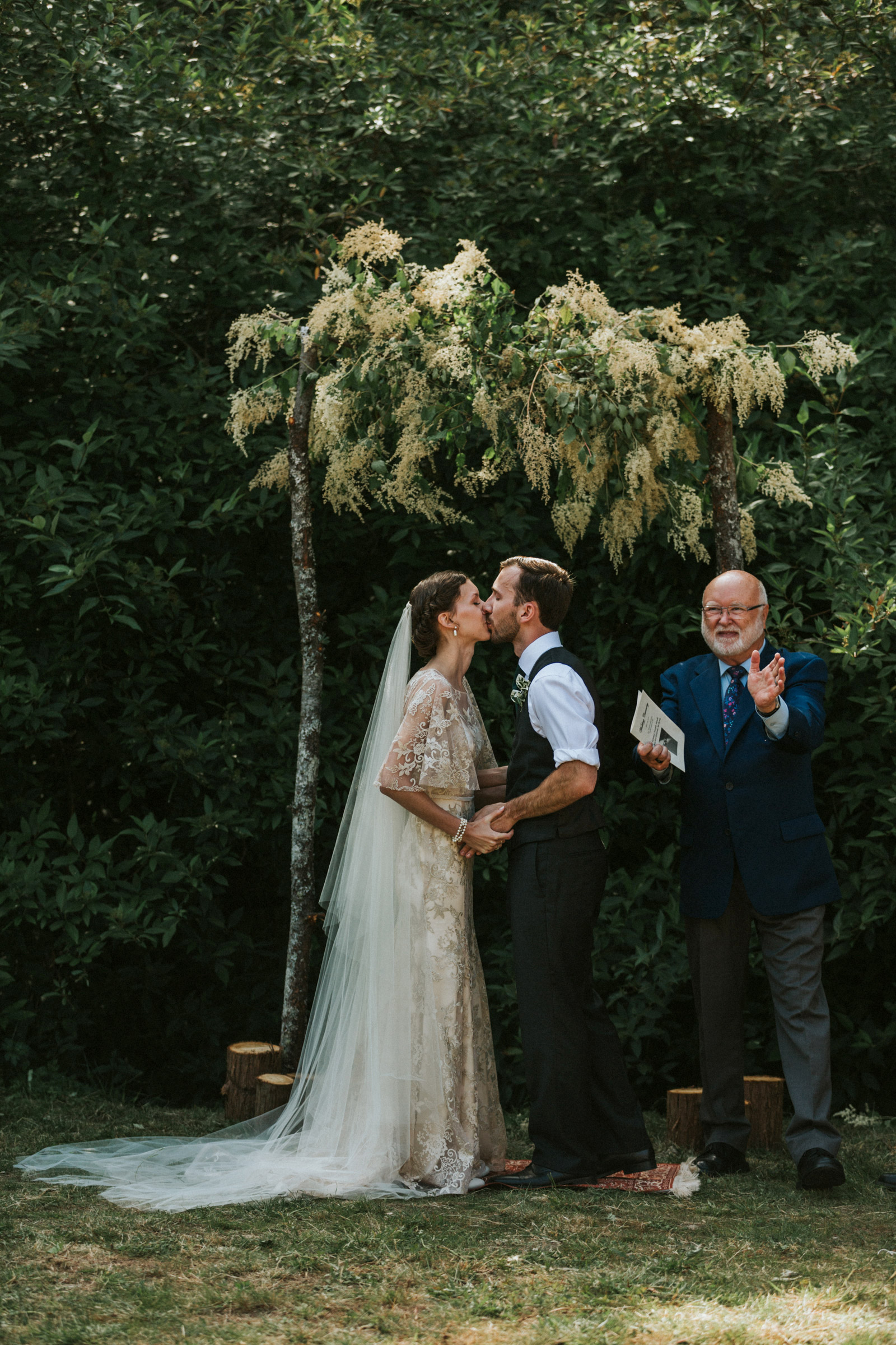 First kiss under decorated arch