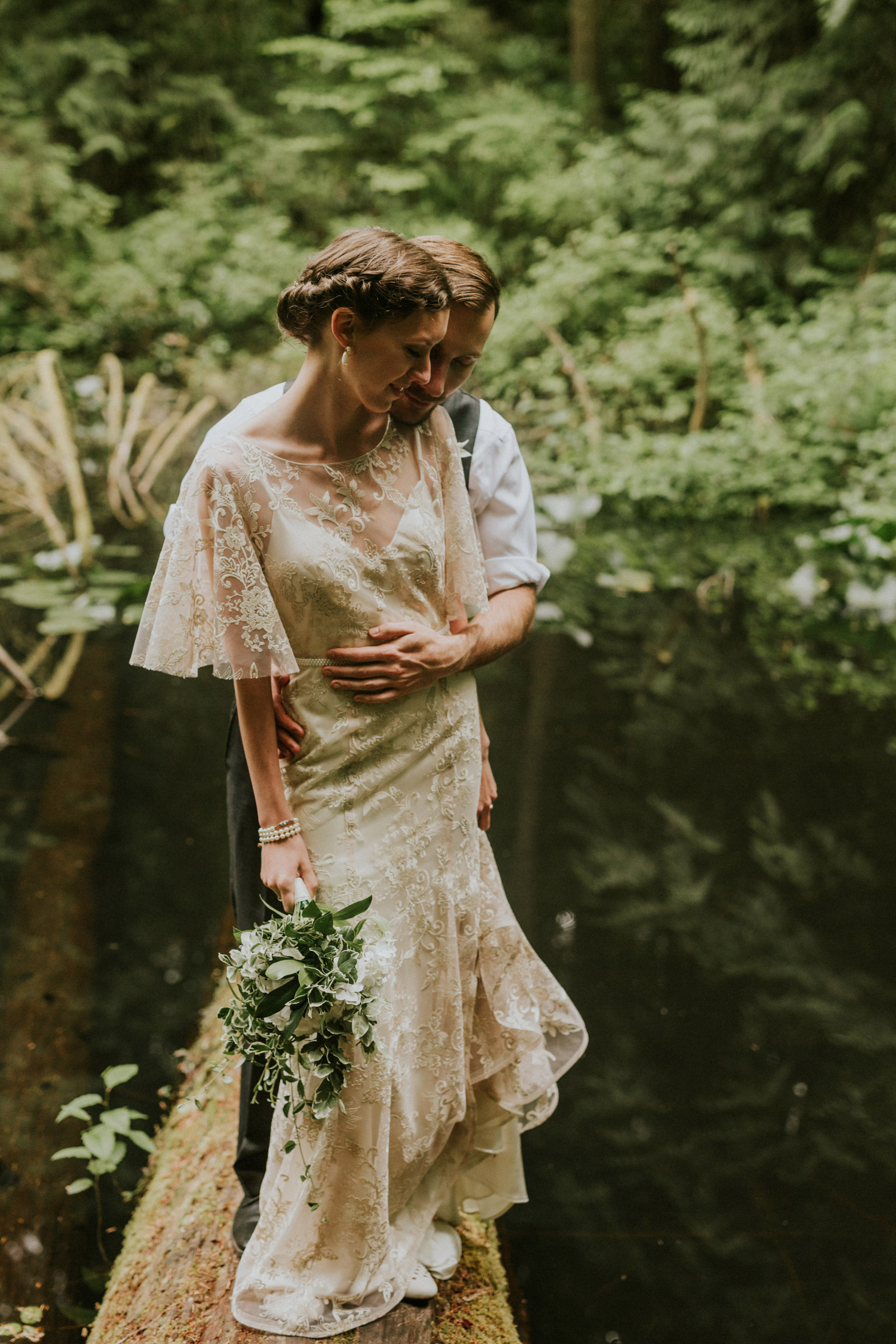 Bride and groom on a log